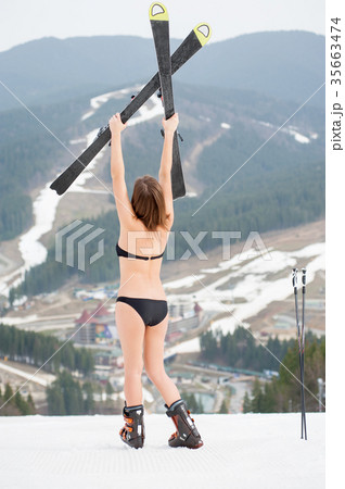 Sexy female skier on snowy slope at ski resort 35663474