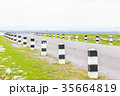 white and black pole barrier and curve road 35664819