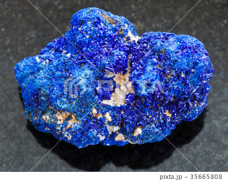 rough crystalline Azurite stone on dark 35665808