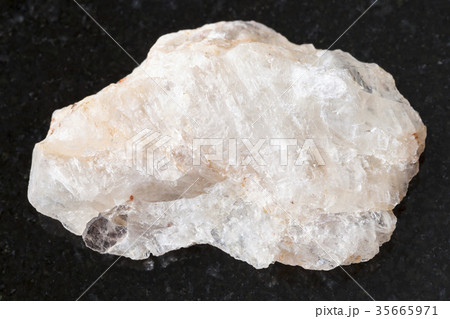 rough belomorite stone on dark background 35665971