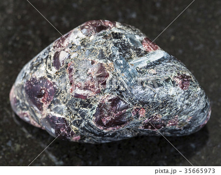 polished Almandine garnet crystals on dark 35665973