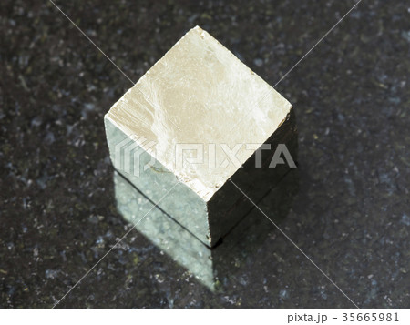 raw pyrite crystal on dark background 35665981