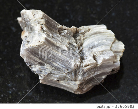 rough baryte stone on dark background 35665982