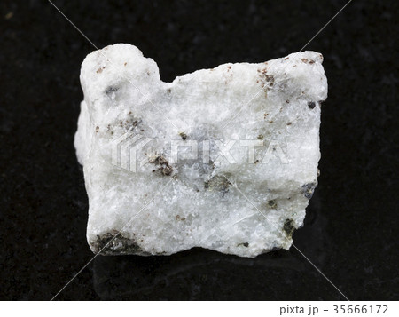 raw carbonatite stone on dark background 35666172