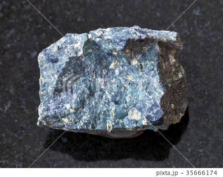 rough Kimberlite stone on dark background 35666174