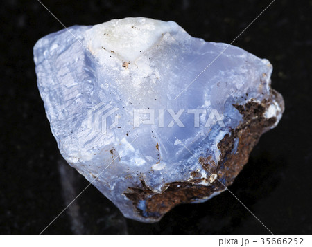 rough crystal of blue Chalcedony gemstone on dark rough crystal of blue Chalcedony gemstone on dark 35666252