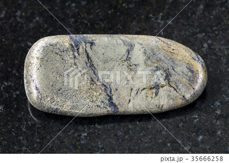 polished Arsenopyrite stone on dark background polished Arsenopyrite stone on dark background 35666258