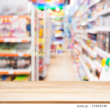 Wooden empty table in front of of kids toy store 35668586