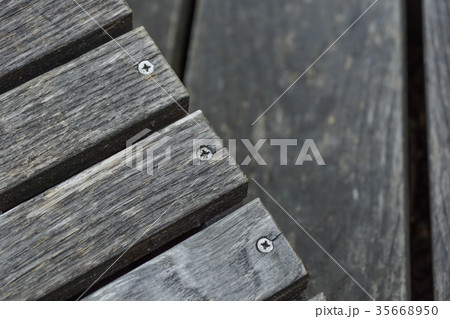 A row of stylish deck chairs . wooden board A row of stylish deck chairs . wooden board 35668950