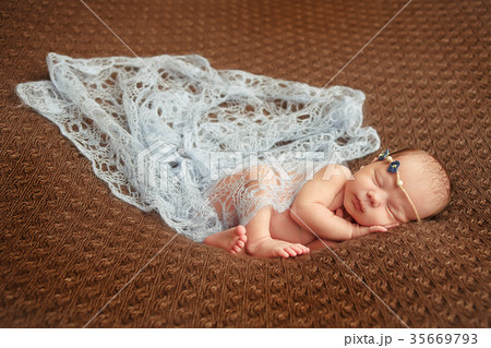 Newborn baby tender sleeping on wool Newborn baby tender sleeping on wool 35669793