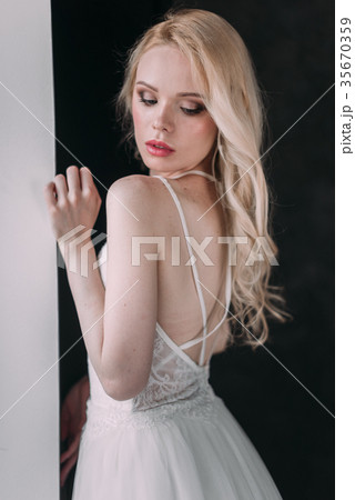 Portrait of a beautiful blond girl bride 35670359