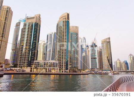 Dubai marina view at dusk with skyscrapers and calm water 35670391