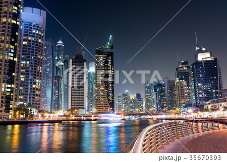 Dubai marina with skyscrapers and calm water night view 35670393