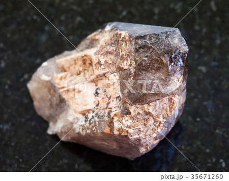 raw crystal of smoky quartz gemstone on dark raw crystal of smoky quartz gemstone on dark 35671260