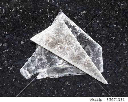 rough muscovite mica lamina on dark background 35671331