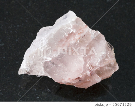 raw crystal of rose quartz gemstone on dark raw crystal of rose quartz gemstone on dark 35671529