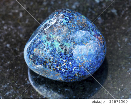 polished Azurite gemstone on dark background 35671569