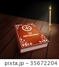 New Testament book on wood table with candle 35672204