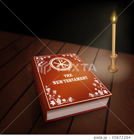 New Testament book on wood table with candle 35672204