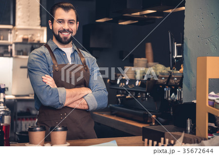 Cheerful barista working in cafe 35672644
