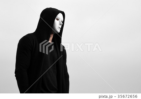 Portrait of man in black hoodie wearing white 35672656