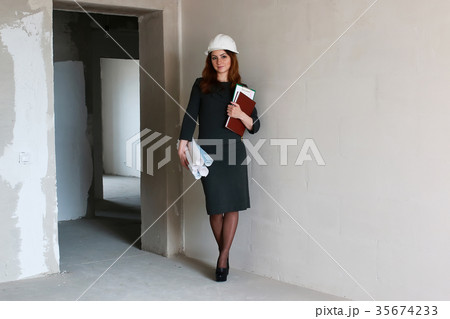 female architect at the construction site with 35674233