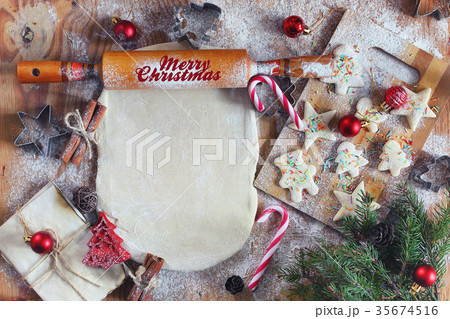 Flour cooking ginger cookies on Christmas Eve Flour cooking ginger cookies on Christmas Eve 35674516