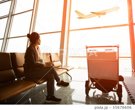 woman sitting in airport terminal  35676606
