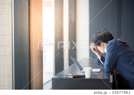 Young Asian man working with laptop in workspace 35677961