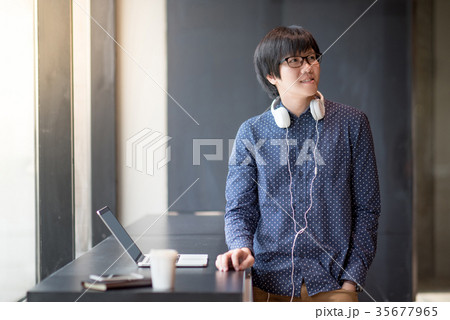Young Asian student man with laptop computer 35677965