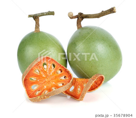 Aegle marmelos and Dry bael fruit on white 35678904