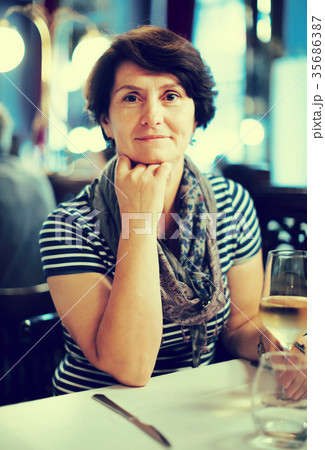 Elderly lonely woman at dinner in restaurant 35686387