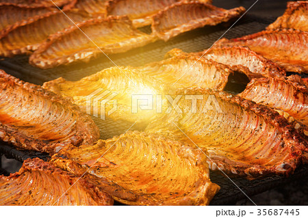 Meat ribs of pig roasting on barbecue 35687445