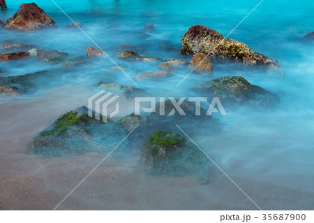 Sea rocks in mist at dusk Sea rocks in mist at dusk 35687900