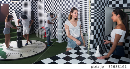 Friends are solving quests to get out of escape room Friends are solving quests to get out of escape room 35688161