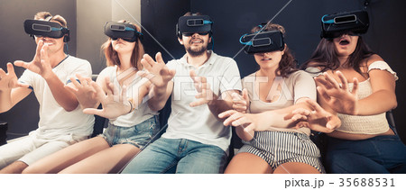 young people using virtual reality glasses young people using virtual reality glasses 35688531