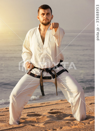 guy demonstrates karate poses 35688953