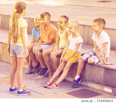 Cheerful boys and girls playing charades 35689604