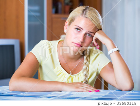 Portrait of adult girl bored at home. 35690318