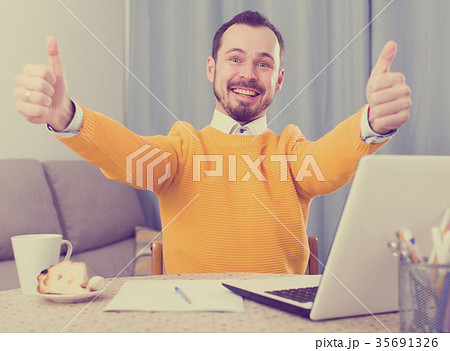 Smiling man communicate by video Smiling man communicate by video 35691326