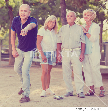 Happy family playing petanque in outdoor 35691369
