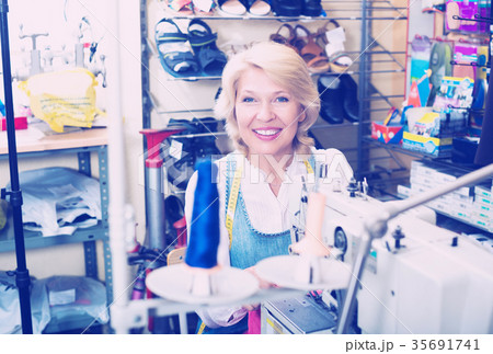 Tailor working on sewing machine 35691741