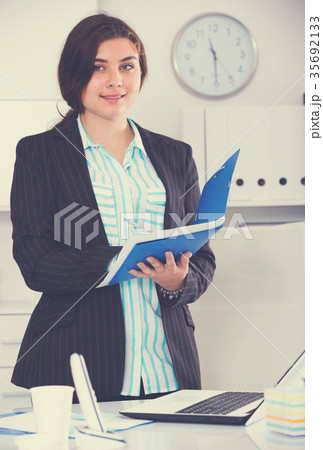 Manager woman is signing agreement papers of financial nature 35692133