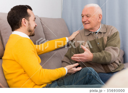 Old father and son friendly conversation Old father and son friendly conversation 35693000