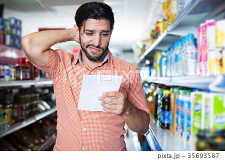 male with note list for looking goods male with note list for looking goods 35693587