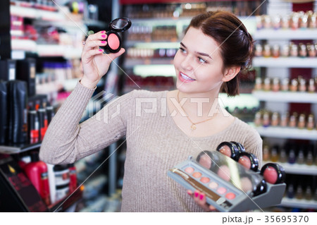 Seller demonstrating assortment 35695370