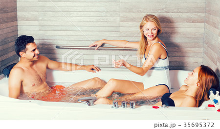 Smiling friends are talking while taking aromatherapy 35695372