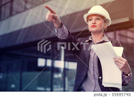 Professional woman pointing finger on object 35695740