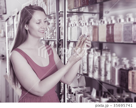 Woman take a choise fresh liquid soap Woman take a choise fresh liquid soap 35695741