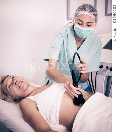 Woman receiving cryoliposuction 35696502